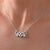 “Sparkling Hearts & Flower Pendant Necklace – Elegant Silver-Tone Charm”
