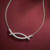 “Elegant Curve Necklace with Cubic Zirconia Detailing”