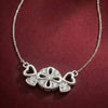 “Sparkling Hearts & Flower Pendant Necklace – Elegant Silver-Tone Charm”