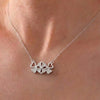 “Sparkling Hearts & Flower Pendant Necklace – Elegant Silver-Tone Charm”