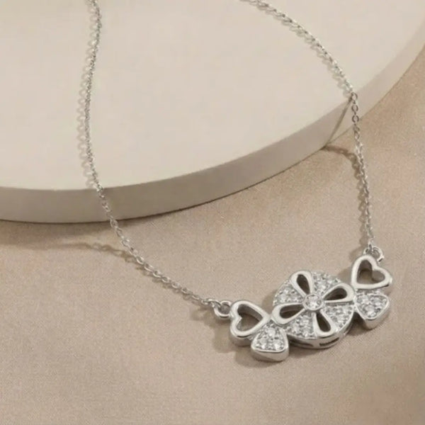 “Sparkling Hearts & Flower Pendant Necklace – Elegant Silver-Tone Charm”